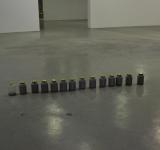 COLLECTING THE WORK IN 12 GLASS VESSELS